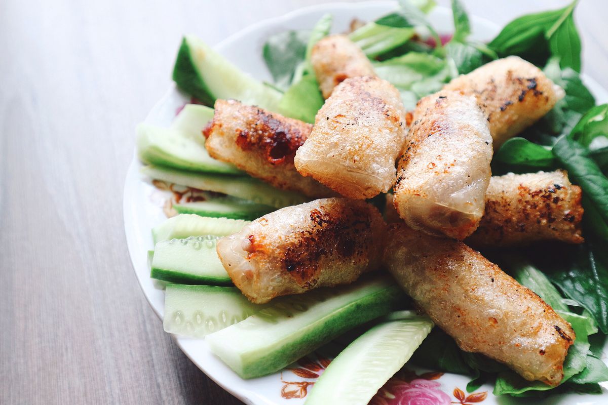 Crispy Vietnamese spring rolls with cucumber and fresh herbs
